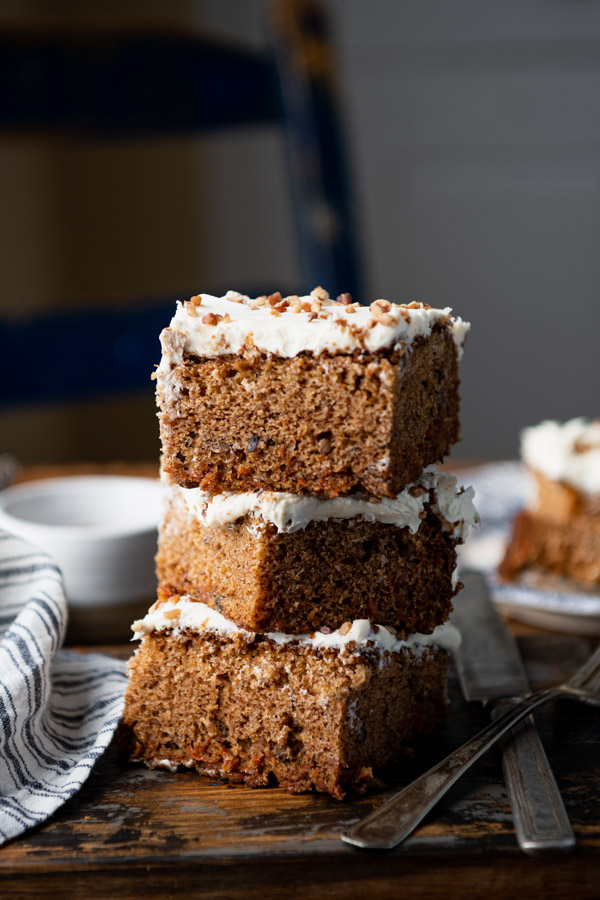 Side shot of a stack of three slices of easy carrot cake recipe