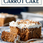 Close up side shot of a fork taking a bite of easy carrot cake recipe with text title box at top
