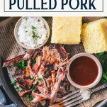 Overhead shot of a plate of pulled pork with text title box at top