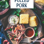 Overhead shot of hands eating a plate of pulled pork with cornbread and coleslaw and text title overlay