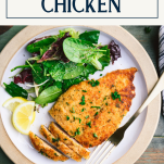 Overhead shot of a plate of Parmesan crusted chicken with text title box at top