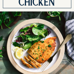 Plate of chicken milanese with salad and text title box at top