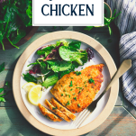 Overhead shot of a dinner plate with chicken milanese and a side salad and text title overlay