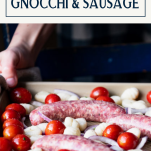 Process shot of making sheet pan gnocchi with sausage and text title box at top