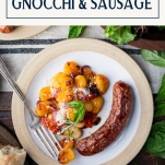 Overhead image of a plate of italian sausage with sheet pan gnocchi and text title box at top