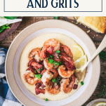 Overhead shot of Southern shrimp and grits recipe in a bowl with text title box at top