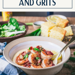 Side shot of a bowl of the best shrimp and grits recipe with text title box at top