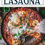 Hands serving skillet lasagna with text title box at top