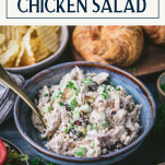 Side shot of the best chicken salad recipe in a blue bowl with text title box at top