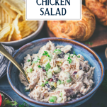 Side shot of southern chicken salad recipe in a blue bowl with text title overlay