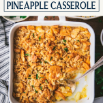 Overhead shot of pineapple casserole in a white dish with text title box at top