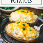 Shot of twice baked potatoes on a plate with text title box at top
