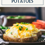 Side shot of two twice baked potatoes on a plate with text title box at top