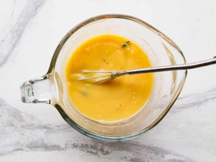Whisking together the sauce.