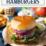 Dinner table with grilled hamburgers and text title box at top