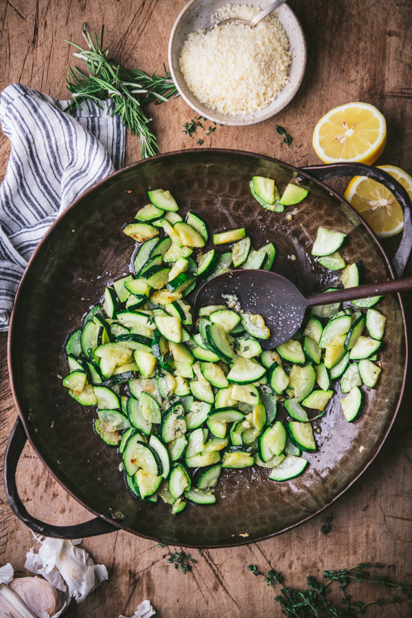 Overhead shot of sauteed zucchini in a big skillet