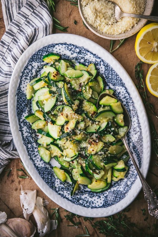 Serving tray full of sauteed zucchini with parmesan garlic and butter