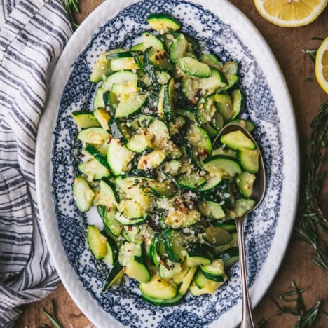 Overhead shot of the best sauteed zucchini recipe on a blue and white serving plate