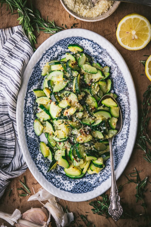 Overhead shot of the best sauteed zucchini recipe on a blue and white serving plate