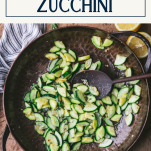 Overhead shot of a skillet of sauteed zucchini with text title box at top