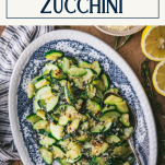 Overhead shot of plate of sauteed zucchini with text title box at top