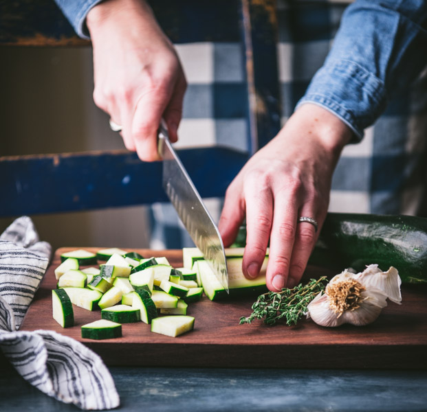 Dicing zucchini on a cutting board