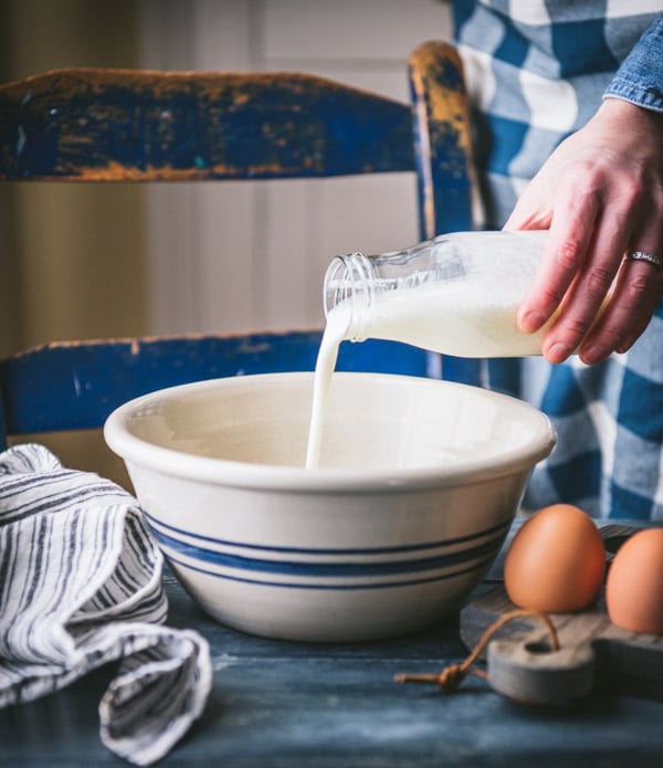 Pouring buttermilk into a bowl