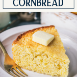 Close up side shot of a piece of sweet cornbread on a plate with text title box at top
