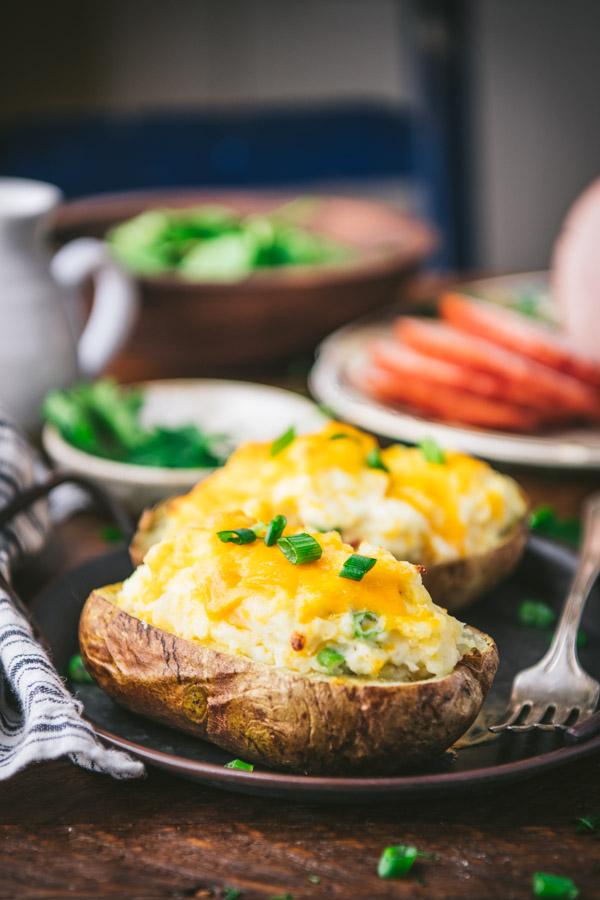 Close up shot of twice baked potatoes on a vintage tray