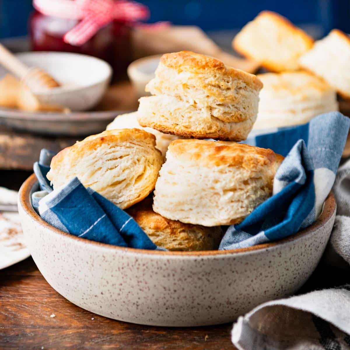 Square side shot of 3 ingredient buttermilk biscuits on a table.