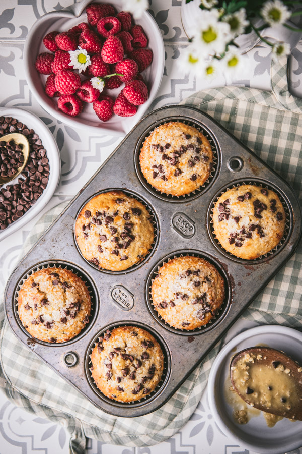 Overhead shot of chocolate chip muffins in a muffin pan.