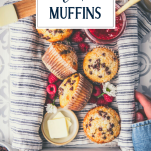 Hands holding a box of chocolate chip muffins with text title overlay