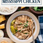 Bowl of chicken mississippi on a wooden table with text title box at top