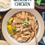 Overhead shot of a bowl of crock pot mississippi chicken with text title overlay