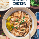 Hands serving a bowl of the best mississippi chicken recipe with text title overlay