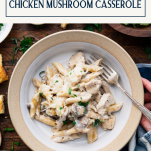 Hands holding a bowl of chicken mushroom casserole with text title box at top