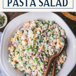 Overhead shot of ham and pasta salad with text title box at top