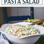 Side shot of ham pasta salad with text title box at top