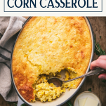 Hands serving a jiffy corn casserole with text title box at top