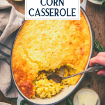 Overhead shot of hands serving a corn casserole with jiffy and text title overlay