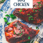 Close overhead image of a platter of oven bbq chicken breast with text title overlay
