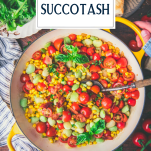 Overhead image of hands holding a skillet of southern succotash with text title overlay