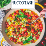 Overhead shot of hands serving succotash from a skillet with text title overlay