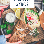 Overhead shot of a plate of chicken gyros with text title overlay