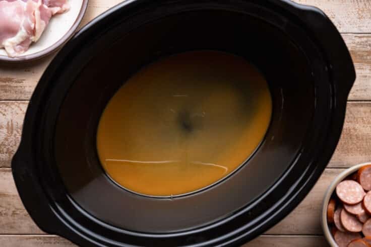 Transferring the roux to a slow cooker.