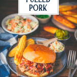 Picnic table with bbq pulled pork sandwiches and sides and text title overlay