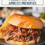 Close up side shot of a pulled pork sandwich with text title box at top