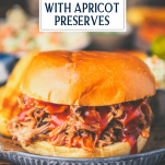 Close up side shot of crock pot pulled pork sandwich with text title overlay