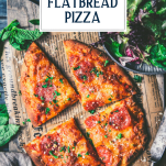 Sliced flatbread pizza on a cutting board with text title overlay