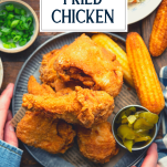 Overhead shot of a plate of the best fried chicken recipe with text title overlay